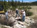 04-Bluebell Lake Stabilization, hand crew trying to break up concrete structure with sledge hammers, used stinger attachment to finish job